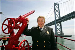 San Francisco Fire Chief Joanne Hayes-White poses aboard the fireboat Phoenix with the Bay Bridge in the background in San Francisco, Friday May 13, 2005. In her department, 230 of 1,700 firefighters are women.