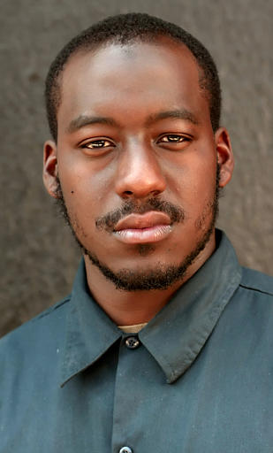 Curtix DeVeaux poses for a photo in Philadelphia Wednesday, June 1, 2005. DeVeaux, a Muslim firefighter suspended because he would not shave his beard on religious grounds has won a preliminary injunction. The city had suspended DeVeaux, citing safety concerns about how protective masks would fit over the beard. The ACLU argues that the suspension violates state law