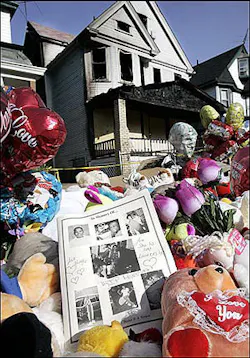 Pictures of the fire victims rest on stuffed animals Wednesday, June 1, 2005, in front of the burned out house in Cleveland in which nine people died. Family members and other mourners tearfully said goodbye Tuesday at a funeral service for nine people who died in a house fire during a birthday sleepover. Hours later, officials said Cleveland's deadliest house fire had been deliberately set. Fire officials had initially said the May 21 blaze appeared to be accidental but reversed course after their investigation. Pictures of the fire victims rest on stuffed animals Wednesday, June 1, 2005, in front of the burned out house in Cleveland in which nine people died. Family members and other mourners tearfully said goodbye Tuesday at a funeral service for nine people who died in a house fire during a birthday sleepover. Hours later, officials said Cleveland's deadliest house fire had been deliberately set. Fire officials had initially said the May 21 blaze appeared to be accidental but reversed course after their investigation.