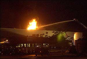 Firefighters battle an explosion at the Conair hair products plant in Rantoul, Ill., Wednesday, June 8, 2005.
