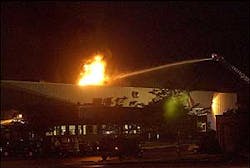 Firefighters battle an explosion at the Conair hair products plant in Rantoul, Ill., Wednesday, June 8, 2005.