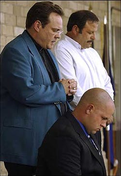 Pastor Joseph James of India Hook Methodist Church leads a prayer for Matt Cooper, 25, right, a firefighter with the Rock Hill Fire Department, during a news conference Wednesday, June 8, 2005, in Rock Hill, S.C. Cooper will be terminated from his job following his June 18, 2005 wedding to Brooke Lowery, 21, because of a city policy that makes it illegal for Cooper to marry a relative of another fire department employee. Cooper's fiancee is the daugther of Fire Capt. Herbie Lowery. Pastor Joseph James of India Hook Methodist Church leads a prayer for Matt Cooper, 25, right, a firefighter with the Rock Hill Fire Department, during a news conference Wednesday, June 8, 2005, in Rock Hill, S.C. Cooper will be terminated from his job following his June 18, 2005 wedding to Brooke Lowery, 21, because of a city policy that makes it illegal for Cooper to marry a relative of another fire department employee. Cooper's fiancee is the daugther of Fire Capt. Herbie Lowery.
