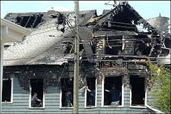 Bridgeport Fire Department officials investigate fire damage to multi-famil home Monday, June 13, 2005, in Bridgeport, Conn. The fire gutted the second and third floors of the wood-frame house, and took two hours to bring under control. Firefighters were able to rescue several residents from the home. Bridgeport Fire Department officials investigate fire damage to multi-famil home Monday, June 13, 2005, in Bridgeport, Conn. The fire gutted the second and third floors of the wood-frame house, and took two hours to bring under control. Firefighters were able to rescue several residents from the home.