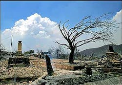 The remains of a home smolder in a section of the Cave Creek Complex Fire, Thursday, June 23, 2005, near Carefree, Ariz. The windblown Arizona blaze burned at least 30,000 acres and forced the evacuation of numerous homes. The remains of a home smolder in a section of the Cave Creek Complex Fire, Thursday, June 23, 2005, near Carefree, Ariz. The windblown Arizona blaze burned at least 30,000 acres and forced the evacuation of numerous homes.