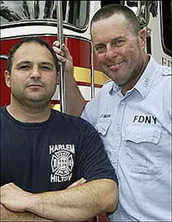 BLAZE OF GLORY: Lt. Kevin Flanagan (right) has a smile on his face after saving a 10-year-old boy from his burning Harlem apartment yesterday with an assist from firefighter Vic Leeber.