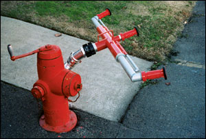 Hooking this emergency decontamination device directly to a hydrant frees apparatus for other operations.