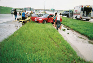 The original scene of the motor vehicle accident on Interstate 820. Medic Selena Schmidt responded in the ambulance that is parked at right.