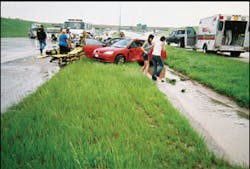 The original scene of the motor vehicle accident on Interstate 820. Medic Selena Schmidt responded in the ambulance that is parked at right.