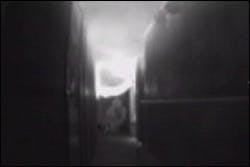 As a company progresses down a smoky hallway, the thermal imager identifies that fire has broken through a hallway door. This shows that the truck company operating in front of the engine risks being cut off, while identifying the apartment of origin to the hose team. As a company progresses down a smoky hallway, the thermal imager identifies that fire has broken through a hallway door. This shows that the truck company operating in front of the engine risks being cut off, while identifying the apartment of origin to the hose team.