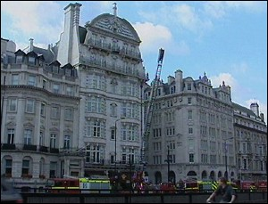 Vehicles of the London fire brigade outside the Hard Rock Cafe, center left, in London, Saturday, July 9, 2005.