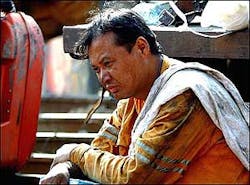 A Chinese rescue worker takes a rest between rescue efforts at the Shenlong Coal Mine in Fukang, northwestern China's Xinjiang region, Monday, July 11, 2005. A Chinese rescue worker takes a rest between rescue efforts at the Shenlong Coal Mine in Fukang, northwestern China's Xinjiang region, Monday, July 11, 2005.