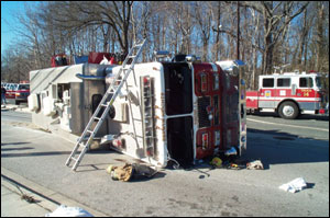 In the accident, Squad 14 landed on its right side, momentarily trapping the officer. This accident should reinforce the rule that everyone should be seated and wearing seatbelts at all times.