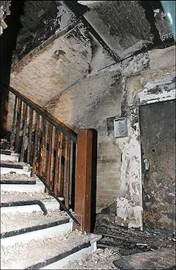 The burned out stairway of a house in Berlin is seen early Tuesday, Aug. 9, 2005. Fire broke out in the stairway of a five-story Berlin apartment building, killing eight people, including four children, in what police said Tuesday may have been arson. The burned out stairway of a house in Berlin is seen early Tuesday, Aug. 9, 2005. Fire broke out in the stairway of a five-story Berlin apartment building, killing eight people, including four children, in what police said Tuesday may have been arson.
