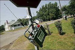 An EPA air monitoring device hangs from a stop sign at the intersection of Avalon Road and Wayne Road near the E.Q. Resource Recovery Inc. plant in Romulus, Mich., Wednesday, Aug. 10, 2005. The facility recycles chemicals such as airplane deicing fluid and industrial paint solvents. An EPA air monitoring device hangs from a stop sign at the intersection of Avalon Road and Wayne Road near the E.Q. Resource Recovery Inc. plant in Romulus, Mich., Wednesday, Aug. 10, 2005. The facility recycles chemicals such as airplane deicing fluid and industrial paint solvents.