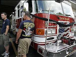 Centre Square, Pa. firemen Chris Lukens,left, and John Croak stand by a fire truck with black bunting draped over the front in memory of fellow firefighter John Kulick who was a Pennsylvania National Guardsman killed in Iraq was the township's assistant fire marshal and worked in the department for seven years. Centre Square, Pa. firemen Chris Lukens,left, and John Croak stand by a fire truck with black bunting draped over the front in memory of fellow firefighter John Kulick who was a Pennsylvania National Guardsman killed in Iraq was the township's assistant fire marshal and worked in the department for seven years.