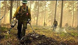 Flagstaff, Ariz., firefighter Derek Schloss, works a wildfire Wednesday, Aug. 10, 2005, near Pomeroy Wash. About 1,600 firefighters and support personnel were assigned to the School fire, which stood at 41,000 acres and was 45 percent contained Wednesday. Flagstaff, Ariz., firefighter Derek Schloss, works a wildfire Wednesday, Aug. 10, 2005, near Pomeroy Wash. About 1,600 firefighters and support personnel were assigned to the School fire, which stood at 41,000 acres and was 45 percent contained Wednesday.