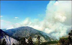 The Tarkio fire near Alberton, Mont., puts up a large plume of smoke Wednesday, Aug. 10, 2005, as winds give the blaze new life. The fire threatens a Bonneville Power Administration transmission line. The Tarkio fire near Alberton, Mont., puts up a large plume of smoke Wednesday, Aug. 10, 2005, as winds give the blaze new life. The fire threatens a Bonneville Power Administration transmission line.
