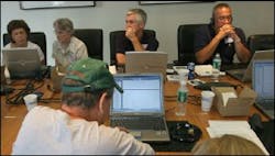9/11 family members Christina Sarafin, far left, Antonia Fontana, second from left, Al Regenhard, center, Gerard Reilly, second from right, and Alfredo Fuentes, both retired from the Fire Department of New York, listen to audio transcripts from 9/11 emergency dispatch tapes made public in New York, Friday Aug. 12, 2005. 9/11 family members Christina Sarafin, far left, Antonia Fontana, second from left, Al Regenhard, center, Gerard Reilly, second from right, and Alfredo Fuentes, both retired from the Fire Department of New York, listen to audio transcripts from 9/11 emergency dispatch tapes made public in New York, Friday Aug. 12, 2005.