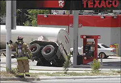 Firefighters contain thousands of gallons of unleaded gasoline spilled when a tank trailer tipped over at a gas station in Fort Worth, Texas, Wednesday, Aug. 17, 2005. The gasoline did not ignite, and run-off gasoline was contained in a creek a few blocks south. Firefighters planned to use a vacuum truck to remove the liquid. Streets for several blocks were blocked off as a safety precaution. Firefighters contain thousands of gallons of unleaded gasoline spilled when a tank trailer tipped over at a gas station in Fort Worth, Texas, Wednesday, Aug. 17, 2005. The gasoline did not ignite, and run-off gasoline was contained in a creek a few blocks south. Firefighters planned to use a vacuum truck to remove the liquid. Streets for several blocks were blocked off as a safety precaution.