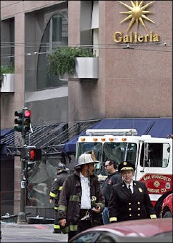 San Francisco Fire Chief Joanne Hayes-White, lower right, investigates the scene of an explosion, Friday, Aug. 19, 2005, in San Francisco.