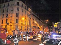 This image made available by the Paris Firefighter Brigade shows firemen evacuating victims after a blaze raced through an apartment building housing African immigrants in Paris, France, Friday Aug. 26, 2005. A least 17 people were killed, half of them children, in the blaze. Many of the victims were from the west African nation of Mali, officials say.