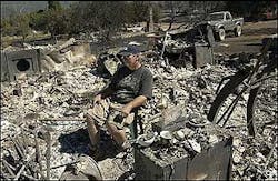 Frank Ketchum, 66, sits in a chair in what used to be his home in Manton, Calif., about 45 miles west of Redding, Sunday morning, Aug. 28, 2005, after a blaze there injured three people and destroyed 30 structures. California Department of Forestry and Fire Protection spokeswoman Sandra Hayes said firefighters believe the blaze was sparked by a vehicle in a dry, grassy area but they could not pinpoint the exact cause. The blaze which began Friday burned 1,830 acres and 30 structures is 60 percent contained with full containment expected Tuesday morning. Frank Ketchum, 66, sits in a chair in what used to be his home in Manton, Calif., about 45 miles west of Redding, Sunday morning, Aug. 28, 2005, after a blaze there injured three people and destroyed 30 structures. California Department of Forestry and Fire Protection spokeswoman Sandra Hayes said firefighters believe the blaze was sparked by a vehicle in a dry, grassy area but they could not pinpoint the exact cause. The blaze which began Friday burned 1,830 acres and 30 structures is 60 percent contained with full containment expected Tuesday morning.