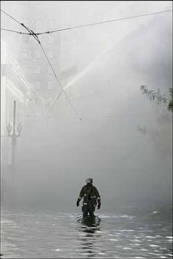 New Orleans firefighters walks through flood water to help battle a building fire in downtown New Orleans, Wednesday, Aug. 31, 2005. Hurricane Katrina left much of the city under water. Officials were uncertain on the cause. New Orleans firefighters walks through flood water to help battle a building fire in downtown New Orleans, Wednesday, Aug. 31, 2005. Hurricane Katrina left much of the city under water. Officials were uncertain on the cause.
