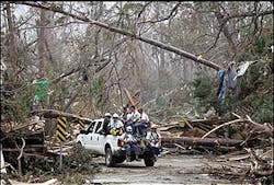 Member of the FEMA Urban Search and Rescue Task Force One team from Virginia make their way through debris from Hurricane Katrina to document corpses in Waveland, Miss. Member of the FEMA Urban Search and Rescue Task Force One team from Virginia make their way through debris from Hurricane Katrina to document corpses in Waveland, Miss.