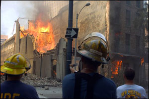 New Orleans firefighters watch as a sandwich shop goes up in flames on Friday, Sept. 2, 2005, in New Orleans. The flames couldn't be doused with water because there was no water pressure