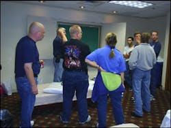 EMT John Brophy of Edgewater New Jersey briefs and solicits input from the initial EMS team as the storm is about to hit New Orleans. When it was over the team he lead grew to a total of 27 people. EMT John Brophy of Edgewater New Jersey briefs and solicits input from the initial EMS team as the storm is about to hit New Orleans. When it was over the team he lead grew to a total of 27 people.