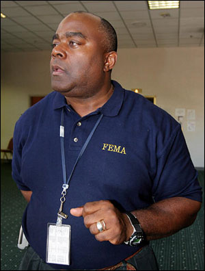Tony Russell, the FEMA official in charge of hundreds of firefighters waiting in Atlanta for deployment orders for the Gulf Coast hit by Hurricane Katrina, talks Tuesday, Sept. 6, 2005, in Atlanta. Russell said he is trying to get the officers deployed as fast as he can but wants to make certain they're sent to where the need is greatest.