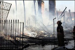 New Orleans firefighter Duaine Daniels helps battle a house fire on the east side of New Orleans, Tuesday, Sept. 6, 2005. Several fires broke out in the downtown area Tuesday. New Orleans firefighter Duaine Daniels helps battle a house fire on the east side of New Orleans, Tuesday, Sept. 6, 2005. Several fires broke out in the downtown area Tuesday.