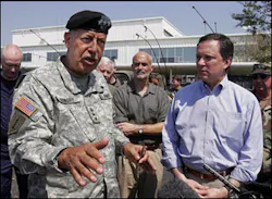 USAF Lt. General Russel Honore, left, talks with reporters in New Orleans, La., Sunday, Sept. 4, 2005. At center is Homeland Security Director Michael Chertoff, and FEMA Director Mike Brown, right.