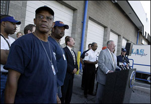 New Orleans firefighter Ronald Mason, left, listens to Las Vegas Mayor Oscar Goodman during a news conference Tuesday, Sept. 6, 2005, in Las Vegas. More than 40 New Orleans firefighters and their loved ones arrived in Las Vegas for a short vacation.