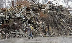 Heaps of twigs and trash, much of it cured efficiently by saltwater, are piled high on streets and sidewalks in Biloxi, Miss., on Thursday, Sept.8, 2005. It's easy to see devastation in millions of broken boards and snapped or uprooted trees, but firefighters and forestry officials see something else: Fuel.