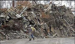 Heaps of twigs and trash, much of it cured efficiently by saltwater, are piled high on streets and sidewalks in Biloxi, Miss., on Thursday, Sept.8, 2005. It's easy to see devastation in millions of broken boards and snapped or uprooted trees, but firefighters and forestry officials see something else: Fuel. Heaps of twigs and trash, much of it cured efficiently by saltwater, are piled high on streets and sidewalks in Biloxi, Miss., on Thursday, Sept.8, 2005. It's easy to see devastation in millions of broken boards and snapped or uprooted trees, but firefighters and forestry officials see something else: Fuel.