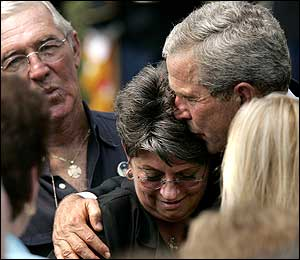 President Bush comforts a family member of New York City Firefighter Kevin M. Prior who died on 9/11 during a ceremony on the South Lawn of the White House, Friday, Sept. 9, 2005. Bush hosted the event for the 9/11 Heroes Medal of Valor Award Ceremony. Nearly four years after the terrorist attacks on the World Trade Center and the Pentagon, Bush praised the heroes of Sept. 11, 2001 and reasserted his commitment to the war on terror.