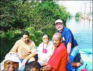 Minden firefighter Capt. John Tucker boats evacuees out of New Orleans.