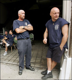 Chris Burack of the New York City Fire Department monitors his radio while standing in the French Quarter of New Orleans, Friday, Sept. 9, 2005.