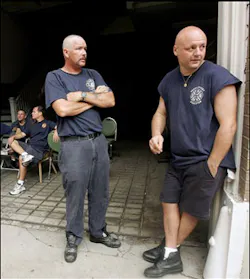 Chris Burack of the New York City Fire Department monitors his radio while standing in the French Quarter of New Orleans, Friday, Sept. 9, 2005. Chris Burack of the New York City Fire Department monitors his radio while standing in the French Quarter of New Orleans, Friday, Sept. 9, 2005.