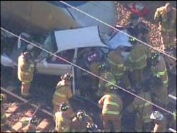 This is image provided by News Channel 8 WTNH-TV shows an Amtrak Acela train that collided with a car at a crossing Wednesday, Sept. 28, 2005, in Hartford, Conn., causing major delays on the Northeast rail line. None of the 130 passengers on the train was injured, according to officials. At least one passenger in the car was flown from the scene by medical helicopter, according to media reports.