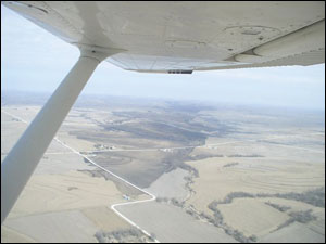 Aerial photo shows the path of the Pottawattamie County fire etching for miles across the landscape.