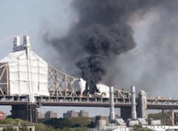 The 59th Street Bridge is choked by smoke yesterday as a fire rages. The 59th Street Bridge is choked by smoke yesterday as a fire rages.