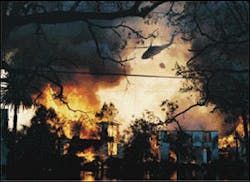 A helicopter makes a water drop on several dwellings. Extensive flooding barred apparatus from gaining access to the area. A helicopter makes a water drop on several dwellings. Extensive flooding barred apparatus from gaining access to the area.