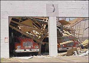 Harrison County Fire Service, Mississippi, Delisle Station after the storm. There is some damage to the cabs of the pumper and tanker plus the rear lights are now missing. The TNT jaws and HPV fan were also stolen off of the pumper. The two trucks are now located at The Central Fire Station, which is partly manned by Tulsa, Oklahoma Firefighters who have come down to aid in relief.