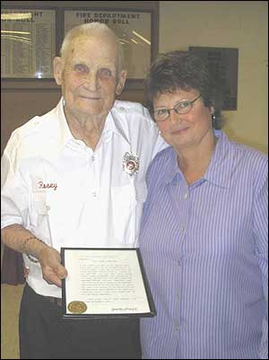 Mayor Judy Henning presents Rosey with a framed thank you from the City of Crete Nebraska.