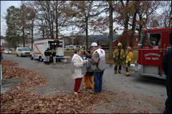 Volunteers with the American Red Cross assist Chattanooga firefighters on the scene of this morning’s deadly fire.