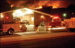 Fire resources mass in front of Los Angeles County Fire Department Station 125 as the fire threatens to jump south of Highway 101, which could have been a repeat of previous disastrous fires that burned to the Pacific Ocean in Malibu.