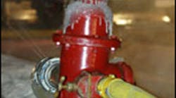 Water leaking from a hydrant is quickly frozen, causing an icy condition on the fireground.