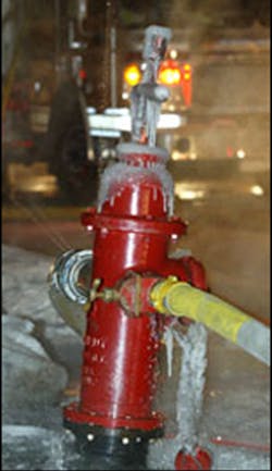 Water leaking from a hydrant is quickly frozen, causing an icy condition on the fireground.